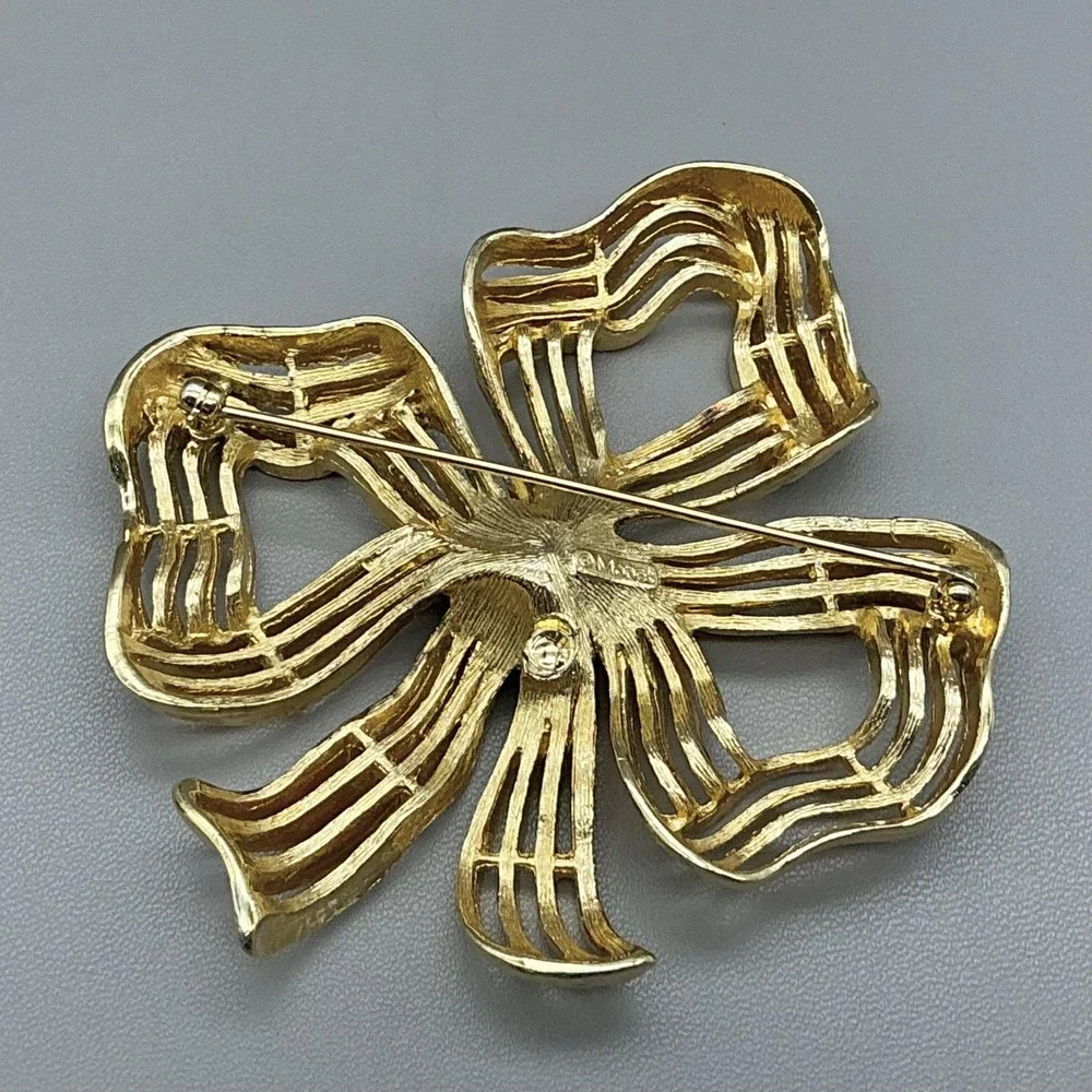Monet Gold Tone Ribbon Bow Brooch‎ Pin Openwork Modernist Signed Costume Jewelry